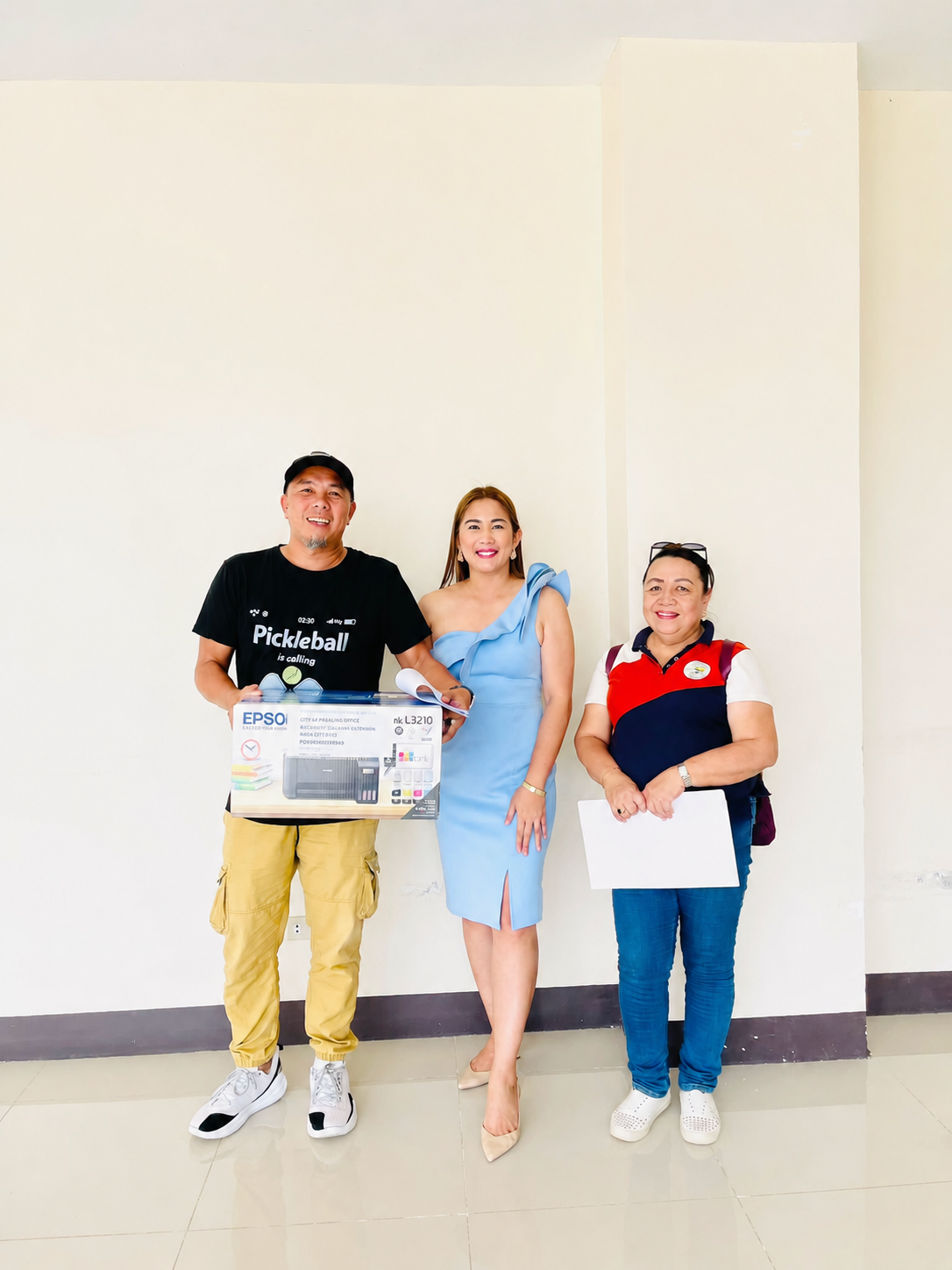 Konsehala Cecille Pagaling with Barangay Aglayan representatives during an Epson printer turnover to a Barangay Nutrition Scholar